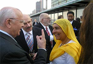 Photo 2. Jessiee Kaur with Mikhail S.Gorbachev<br>outside the UN Plaza in New York