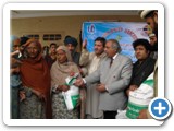 Christian family receiving rice at Lala kalai peshawar