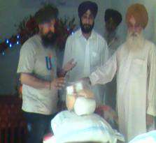 Baba Ji Harbajan Singh from KurramAgency receiving aid
