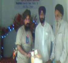 Mehtab Singh from Kuram Agency receiving Aid