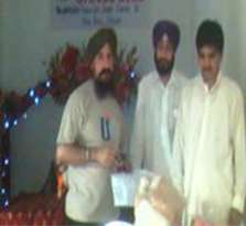 Son of Didar Singh receiving from Kuram Agency receiving Aid