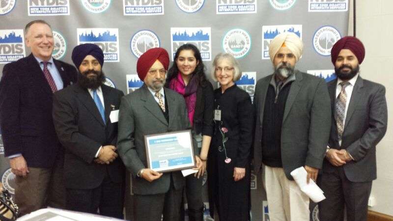 Photo: Members of US being awarded by the President and Vice President of NYDIS.