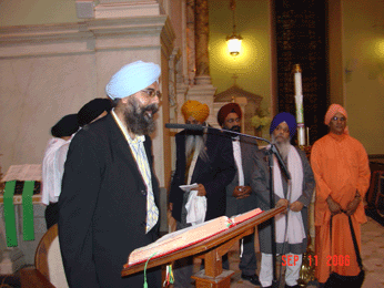 UNITED SIKHS Director Mankanwal Singh, opening the Sikh prayer